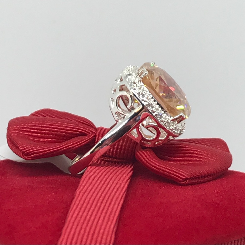 Pretty silver halo ring. peach cz white sapphires